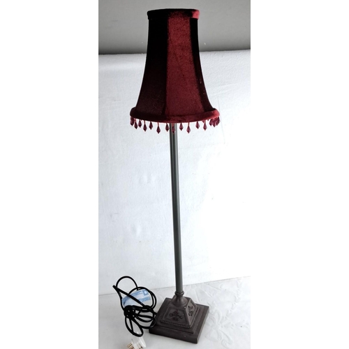 103 - Vintage table lamp with ornate metal base and burgundy velvet lampshade, featuring decorative fringe... 