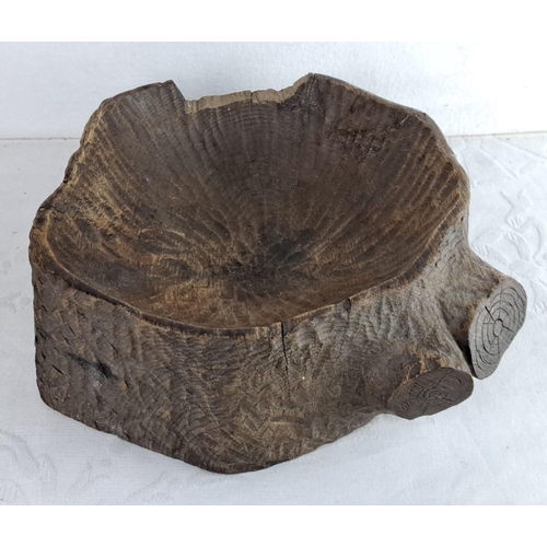 105 - Hand-carved rustic wooden bowl in a tree stump style, showcasing natural grain and texture.