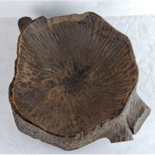 105 - Hand-carved rustic wooden bowl in a tree stump style, showcasing natural grain and texture.