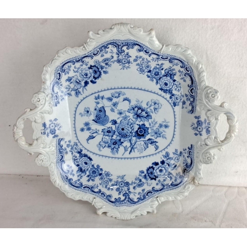 109 - Blue and white ceramic serving platter featuring intricate floral patterns and butterfly motif, with... 