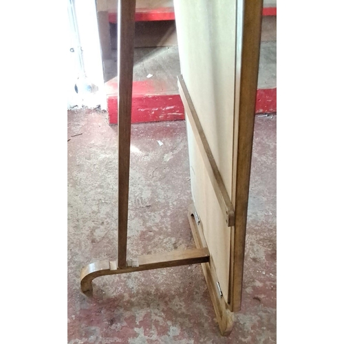 115 - Vintage Full-length wooden standing mirror with curved edges and a supportive base.