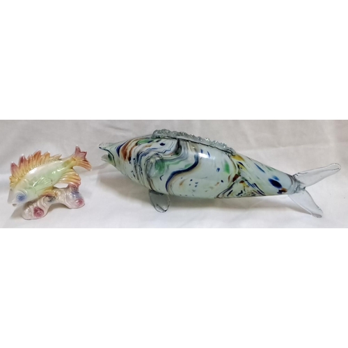 128 - Pair of art glass fish figurines. The first is a multi-color ceramic fish sculpture, and the second ... 