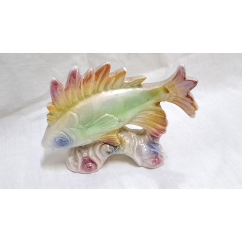 128 - Pair of art glass fish figurines. The first is a multi-color ceramic fish sculpture, and the second ... 