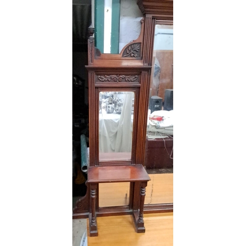 138 - Victorian mahogany overmantel mirror with intricate carvings and side shelves. Features floral and l... 