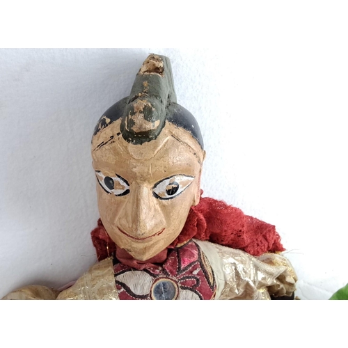 148 - Vintage hand-painted wooden puppet with ornate fabric costume. Features a distinctive facial express... 