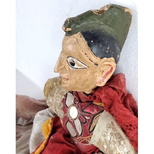 148 - Vintage hand-painted wooden puppet with ornate fabric costume. Features a distinctive facial express... 