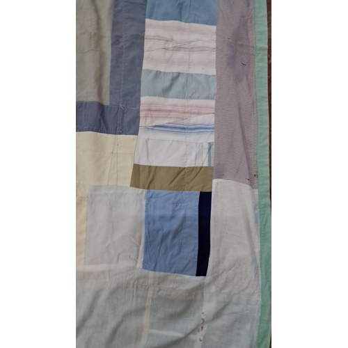 153 - Patchwork quilt features a variety of cotton fabric squares in blue, green, beige, and white hues.