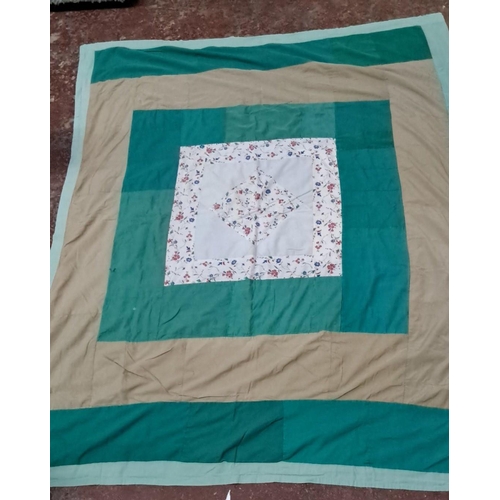 153 - Patchwork quilt features a variety of cotton fabric squares in blue, green, beige, and white hues.