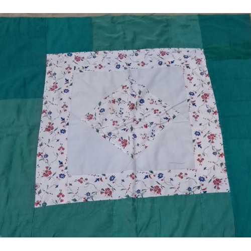 153 - Patchwork quilt features a variety of cotton fabric squares in blue, green, beige, and white hues.