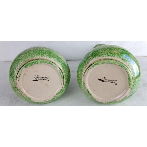 156 - Pair of green and gold accented stoneware vases with loop handles.