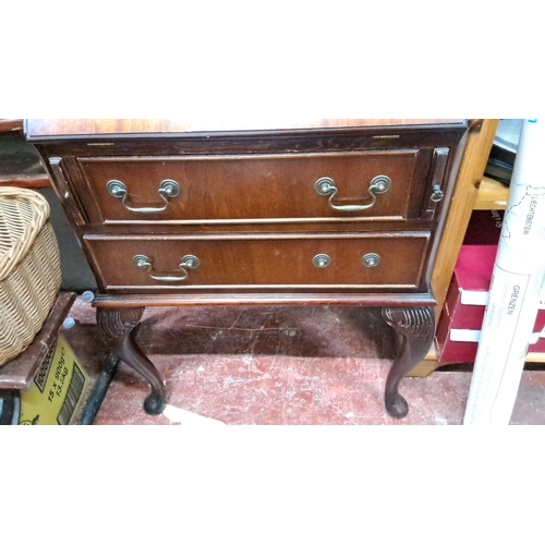 162 - Mahogany writing bureau with Queen Anne style legs, features two drawers with brass handles and a dr... 