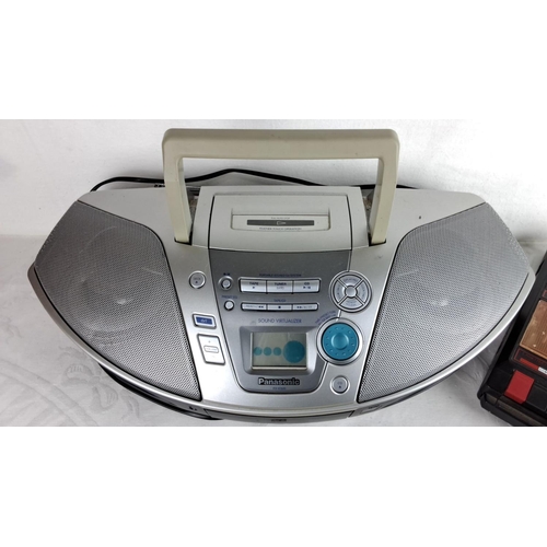 169 - Panasonic RX-ES20 portable stereo system with cassette, CD, and radio functions. Includes an older m... 