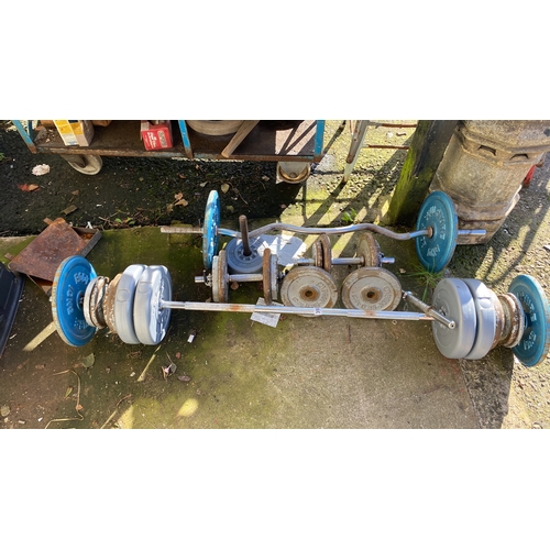 393 - Mixed lot of weightlifting equipment, includes various weights, barbells, and dumbbells. Brands incl... 