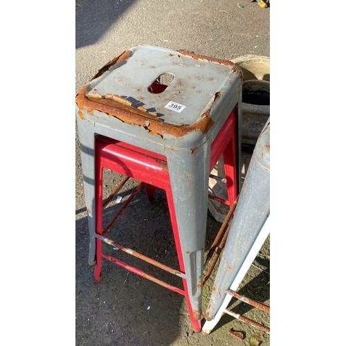 395 - Set of four vintage metal bar stools with distressed paint.