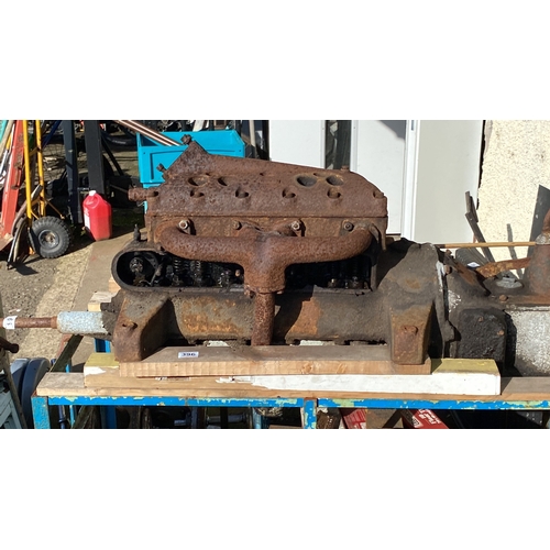 396 - Vintage Morris Cowley engine block and components, displayed on a metal trolley unit with various me... 