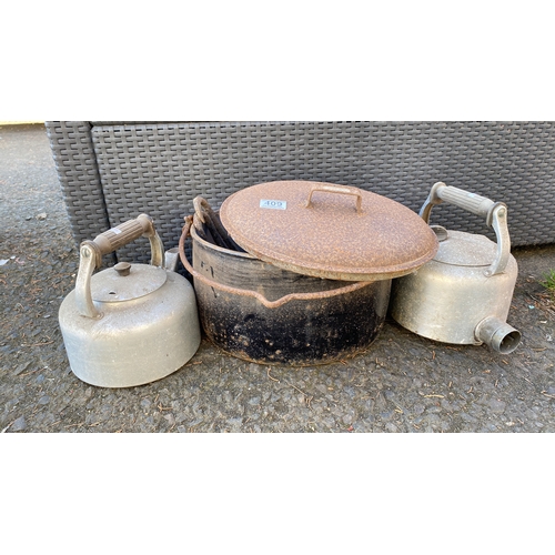 409 - Three vintage metal items: two aluminum kettles with handles and a large metal pot with lid and hand... 