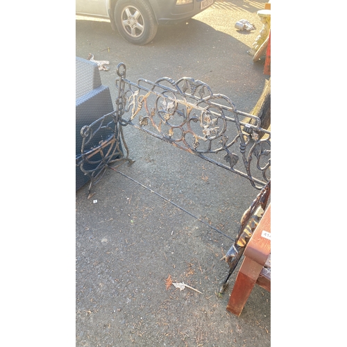 413 - Victorian wrought iron bench frame with intricate floral and vine motifs.