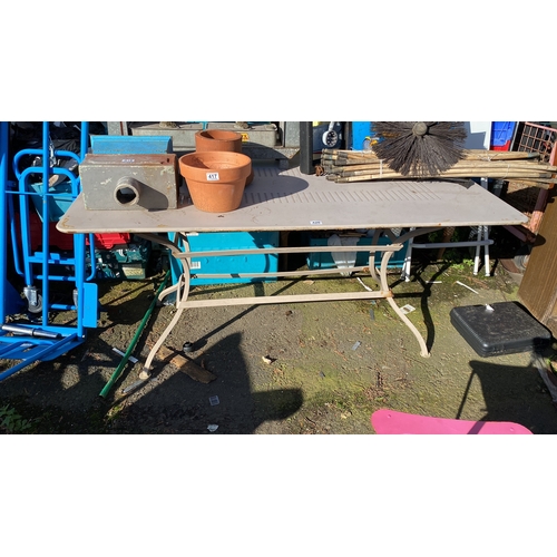 420 - Outdoor table with metal frame.