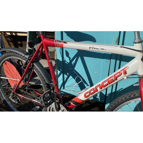 425 - Mountain bike with Shimano gear system, red and white frame, and ProMax handbrakes.