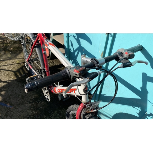 425 - Mountain bike with Shimano gear system, red and white frame, and ProMax handbrakes.