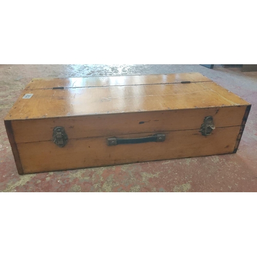 352 - Vintage wooden toolbox with metal latches and handle, featuring a hinged lid and internal compartmen... 