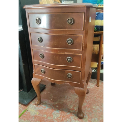 362 - Mahogany Queen Anne-style four-drawer dresser with curved drawer fronts and decorative brass pulls.