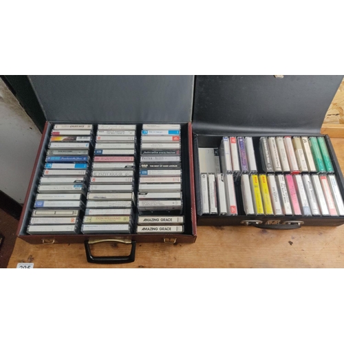 363 - Collection of vintage cassette tapes featuring various artists and genres, neatly organized in carry... 