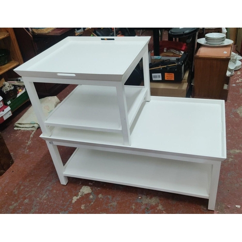 366 - Two white coffee tables. Modern design with clean lines, featuring multiple levels by designer Neptu... 