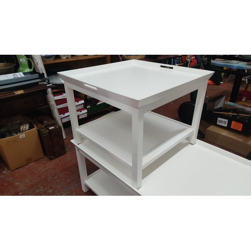 366 - Two white coffee tables. Modern design with clean lines, featuring multiple levels by designer Neptu... 