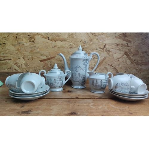 368 - Porcelain tea set with scenic black and silver landscape design includes teapot, cups, saucers, suga... 