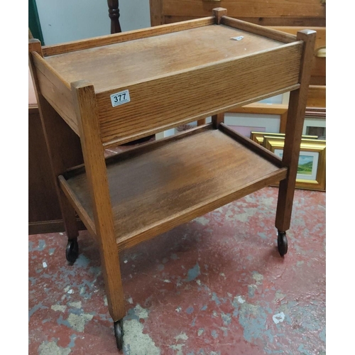 377 - Oak serving trolley with two tiers, original castors, and integrated drawer. Mid-Century Modern desi... 