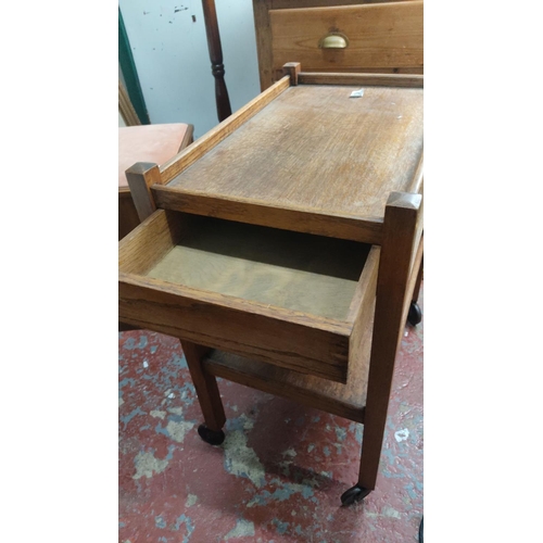 377 - Oak serving trolley with two tiers, original castors, and integrated drawer. Mid-Century Modern desi... 