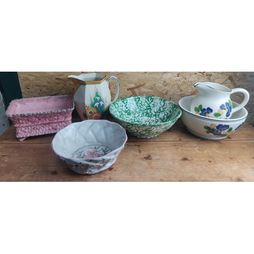 389 - Mixed lot of vintage ceramics including pitchers and bowls, featuring a floral-painted jug, green an... 