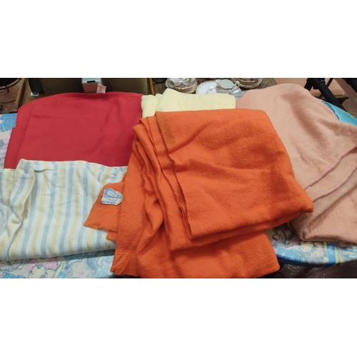 391 - Mixed lot of assorted wool and cotton blankets, including vintage orange blanket with original label... 