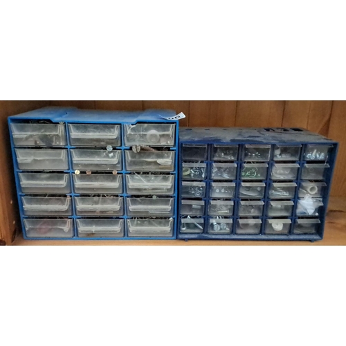 306 - Plastic storage drawers featuring a blue frame and multiple transparent drawers. The drawers contain... 