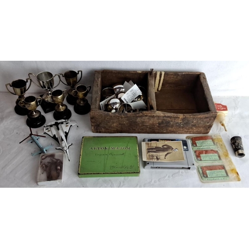 309 - Mixed lot of vintage items includes small trophies, wooden box, toy aircraft, tin box, and ornate me... 