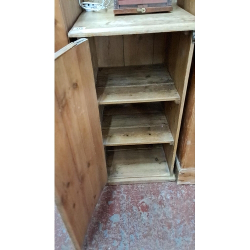 319 - Vintage wooden cabinet with single front door and three interior shelves.