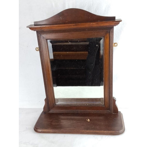 337 - Edwardian mahogany vanity mirror with ornate detailing. Features pivoting glass and a sturdy base.