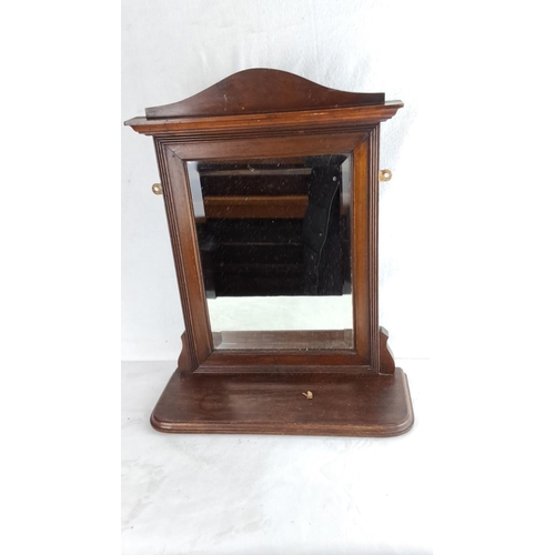 337 - Edwardian mahogany vanity mirror with ornate detailing. Features pivoting glass and a sturdy base.