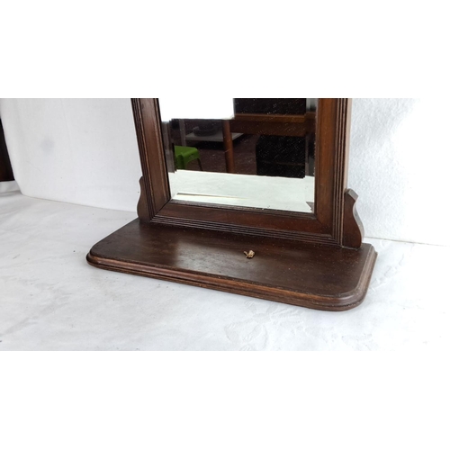 337 - Edwardian mahogany vanity mirror with ornate detailing. Features pivoting glass and a sturdy base.