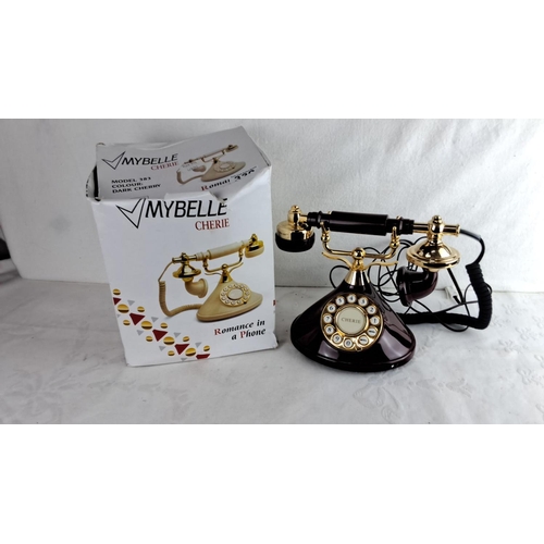 339 - MyBelle Cherie Model 383 dark cherry rotary dial telephone features gold-tone accents and vintage-in... 