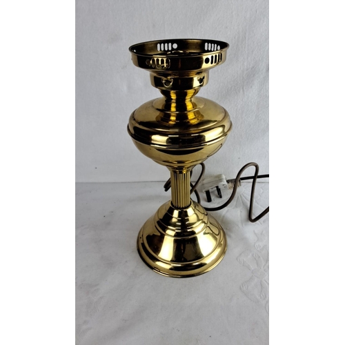 340 - Vintage electric brass table lamp features a classic urn shape design with a polished finish and flu... 