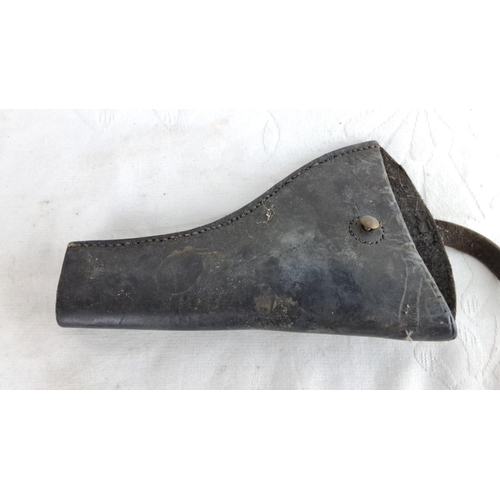 344 - Black leather holster with stitched seams and button closure. Period unknown.