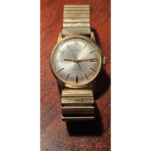 332 - A stunning vintage 9ct gold cased Gents 'Garrard' automatic wristwatch, engraved to rear of case, on... 