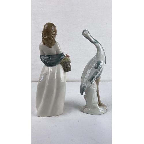 16 - Pair of porcelain figurines, depicting a woman and a heron. Marked by Mirmasu, Spain.