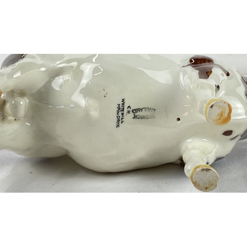 28 - Beswick porcelain cow figurine, hand-painted with brown and white glaze. Marked 