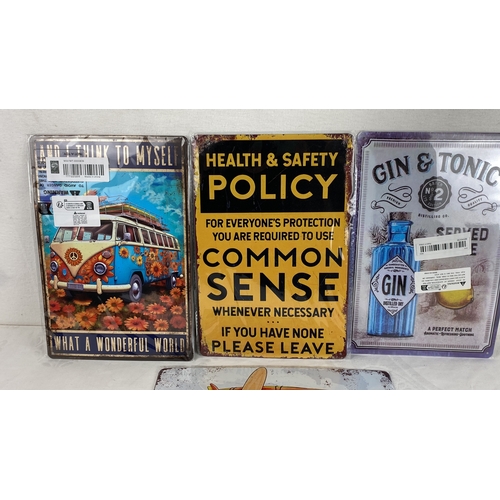 33 - Set of four vintage-style metal signs featuring beach and camper van illustrations, plus humorous te... 