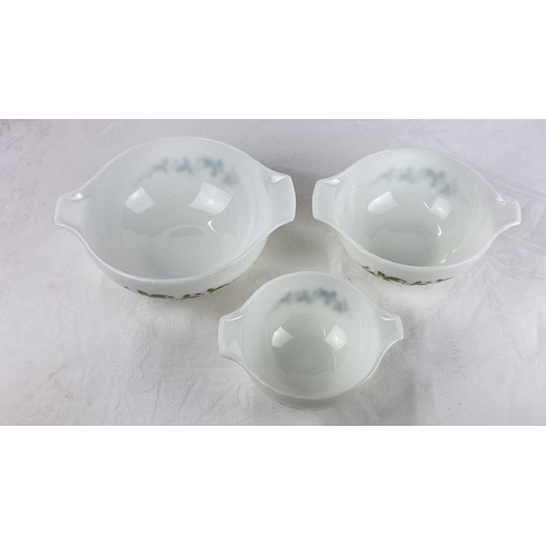 38 - Set of three Pyrex mixing bowls, white with green ivy pattern. Made in England.