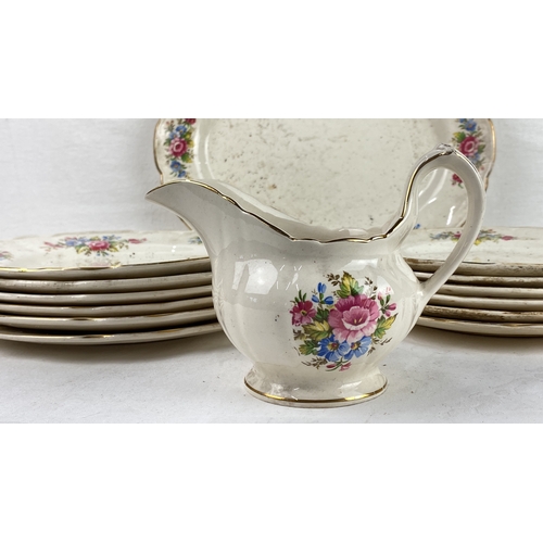 57 - Early Arklow Pottery floral jug and plates set, made in Ireland. Features vibrant floral motifs with... 