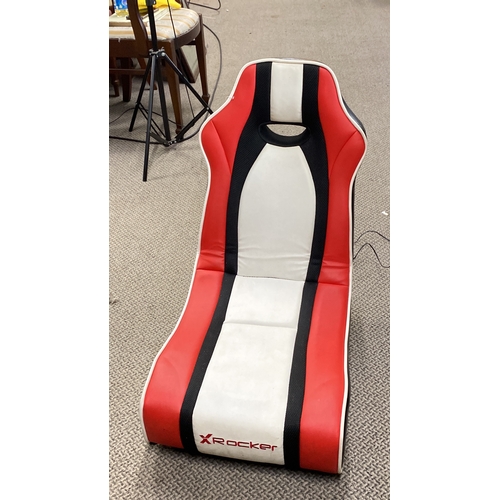 425 - X Rocker gaming chair in red, white, and black faux leather.